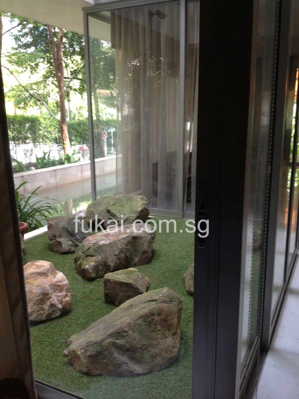 Artificial Green Grass With Artistic Rock Formation