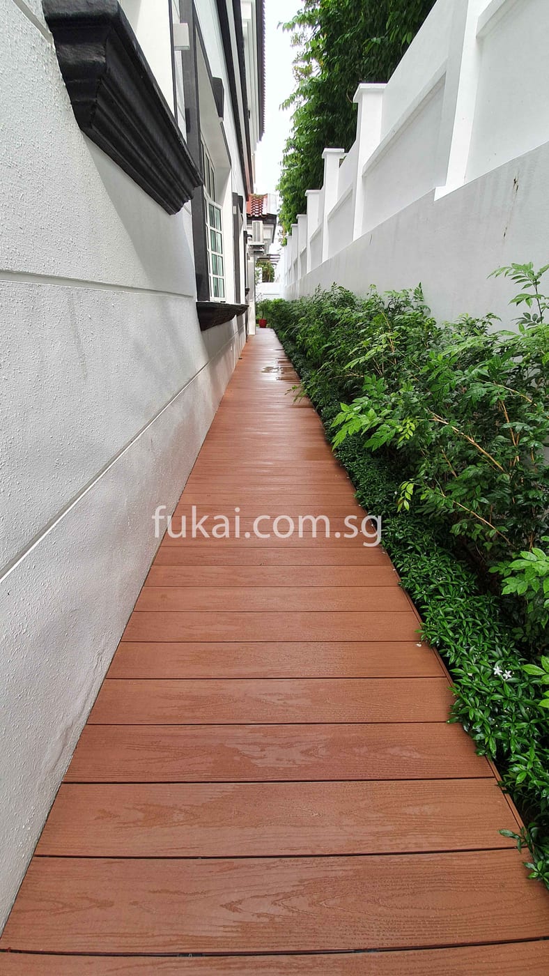 Composite Timber Decking At Side Garden With Plants