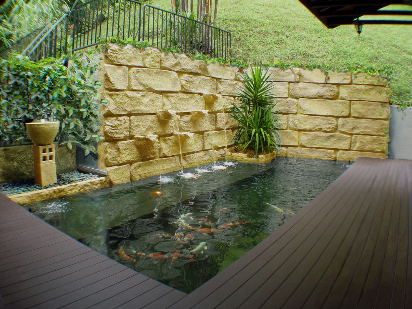 Koi Pond And Wall Water Feature At Retaining Wall