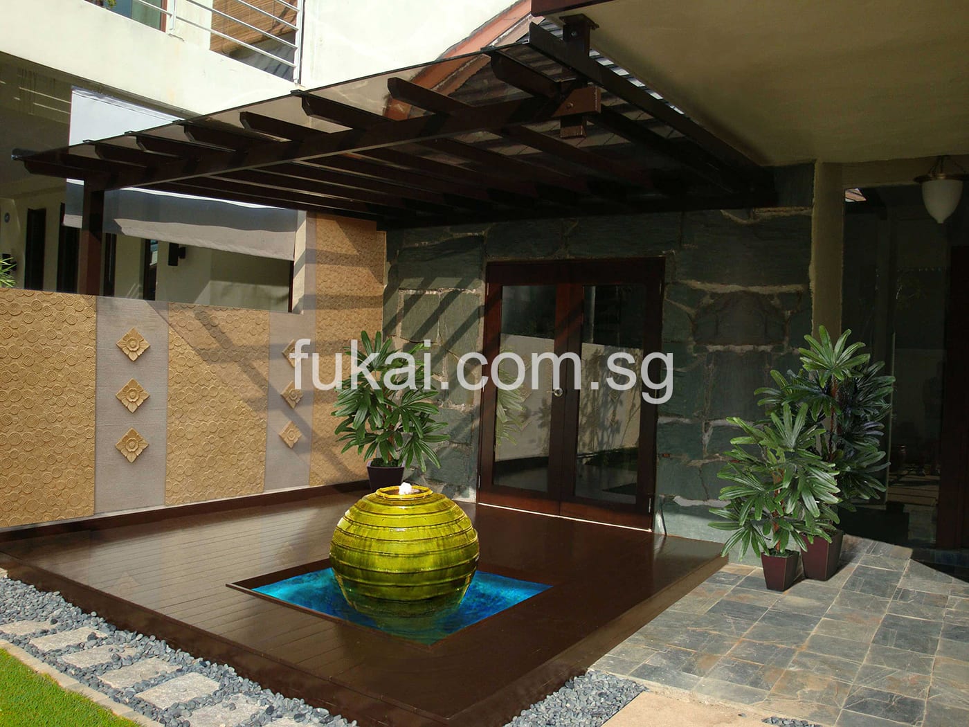 Timber Trellis And Raised Up Platform With Sunken In Pond Feature At Front Garden