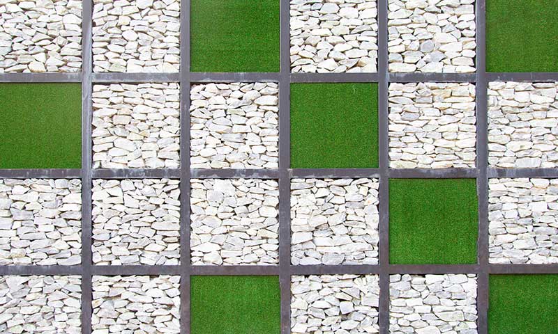 artificial grass and white pebbles formation