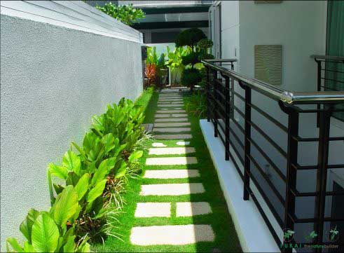 artistic stepping stone landscape in a green grass